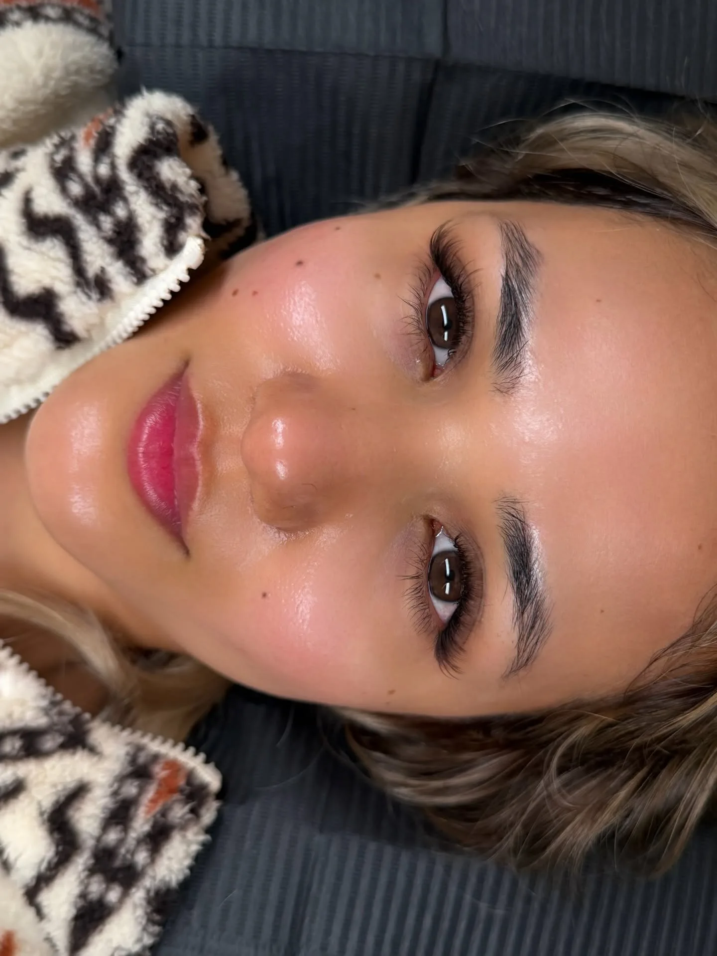 Client with natural lash extensions and fluffy brows