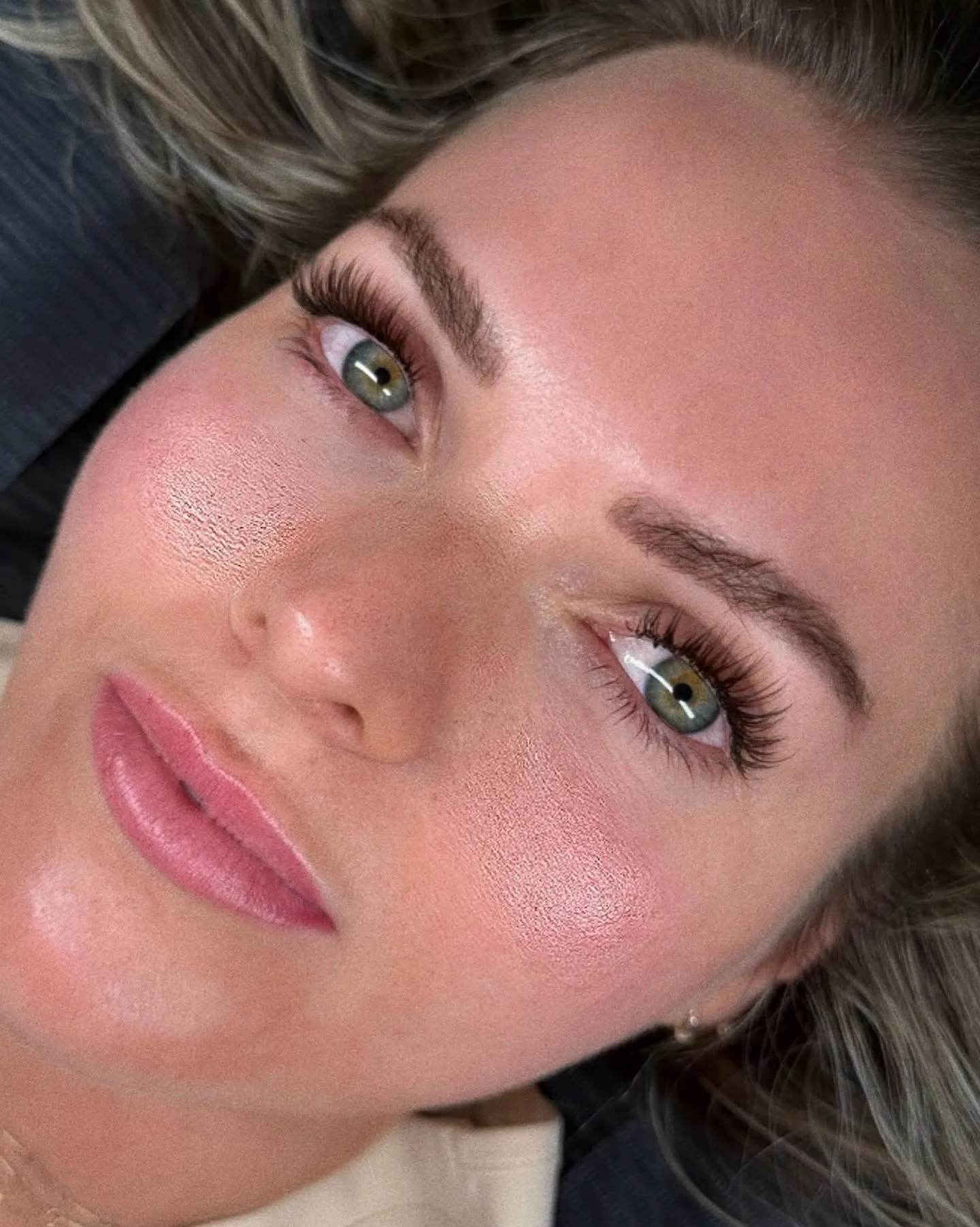Client with soft natural lash set — green eyes, warm daylight